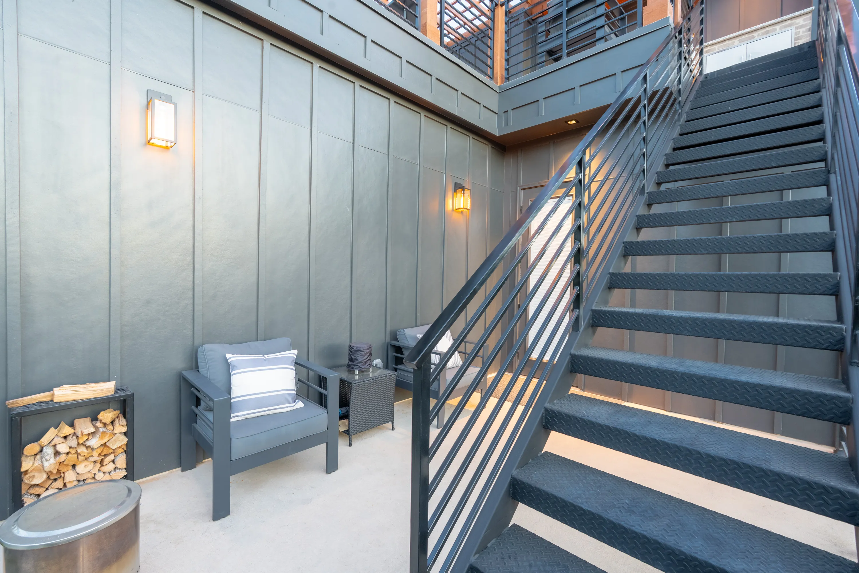 Floating wood staircase with a black steel stringer, an example of Ella Bree craftsmanship.