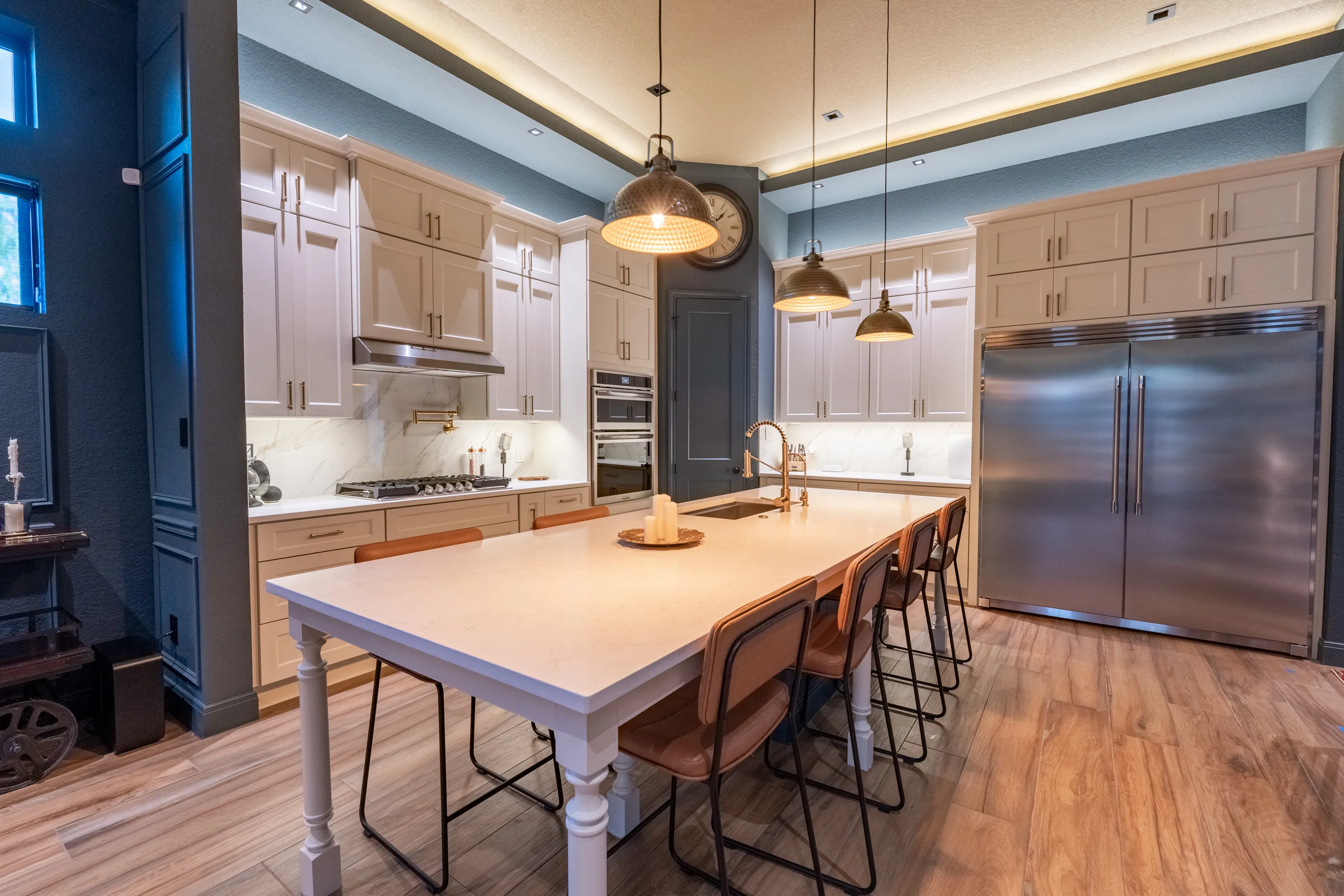 Kitchen with quartz island and full-wood cabinetry in an Ella Bree custom home.